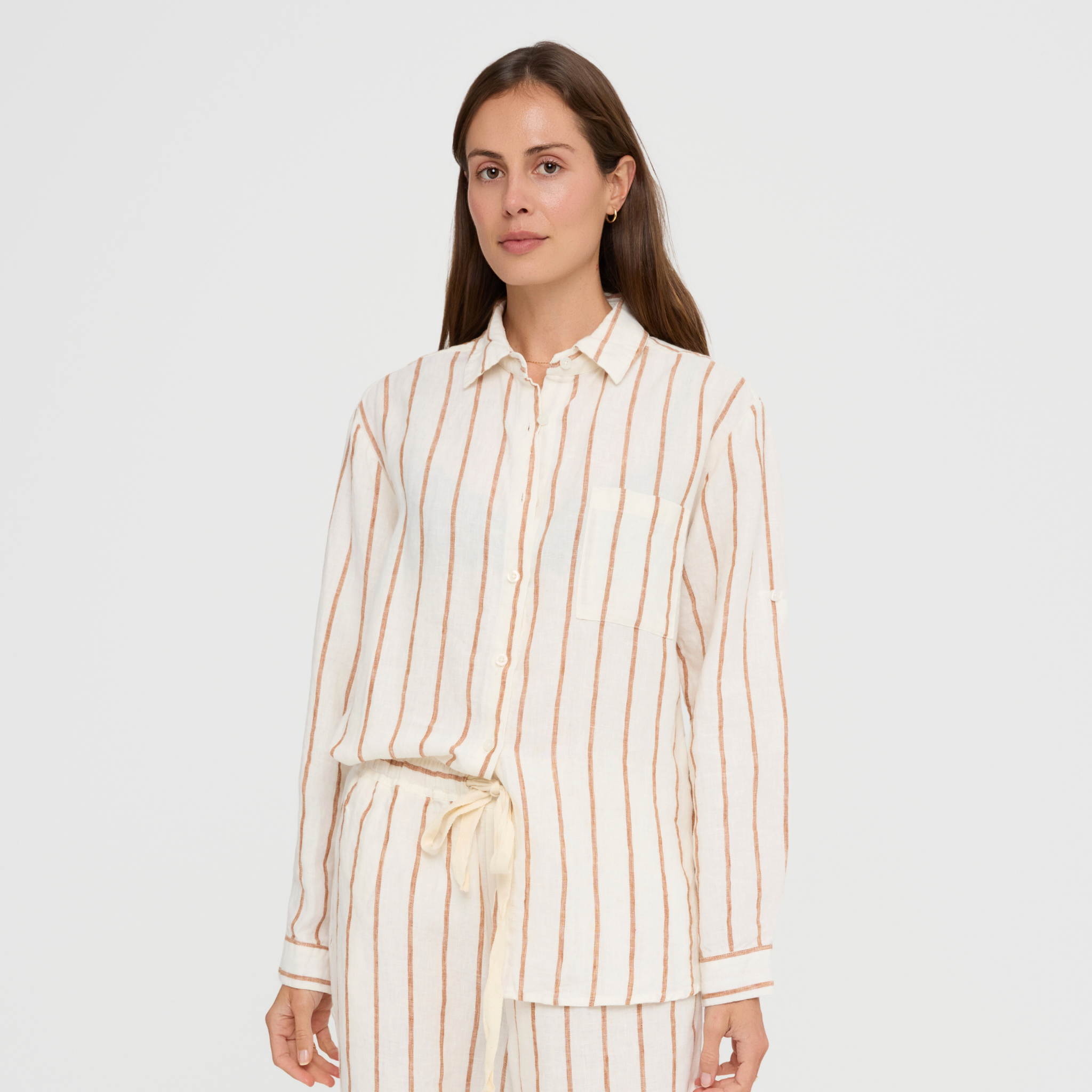 Linen lounge top with pocket, long sleeves, and button front design