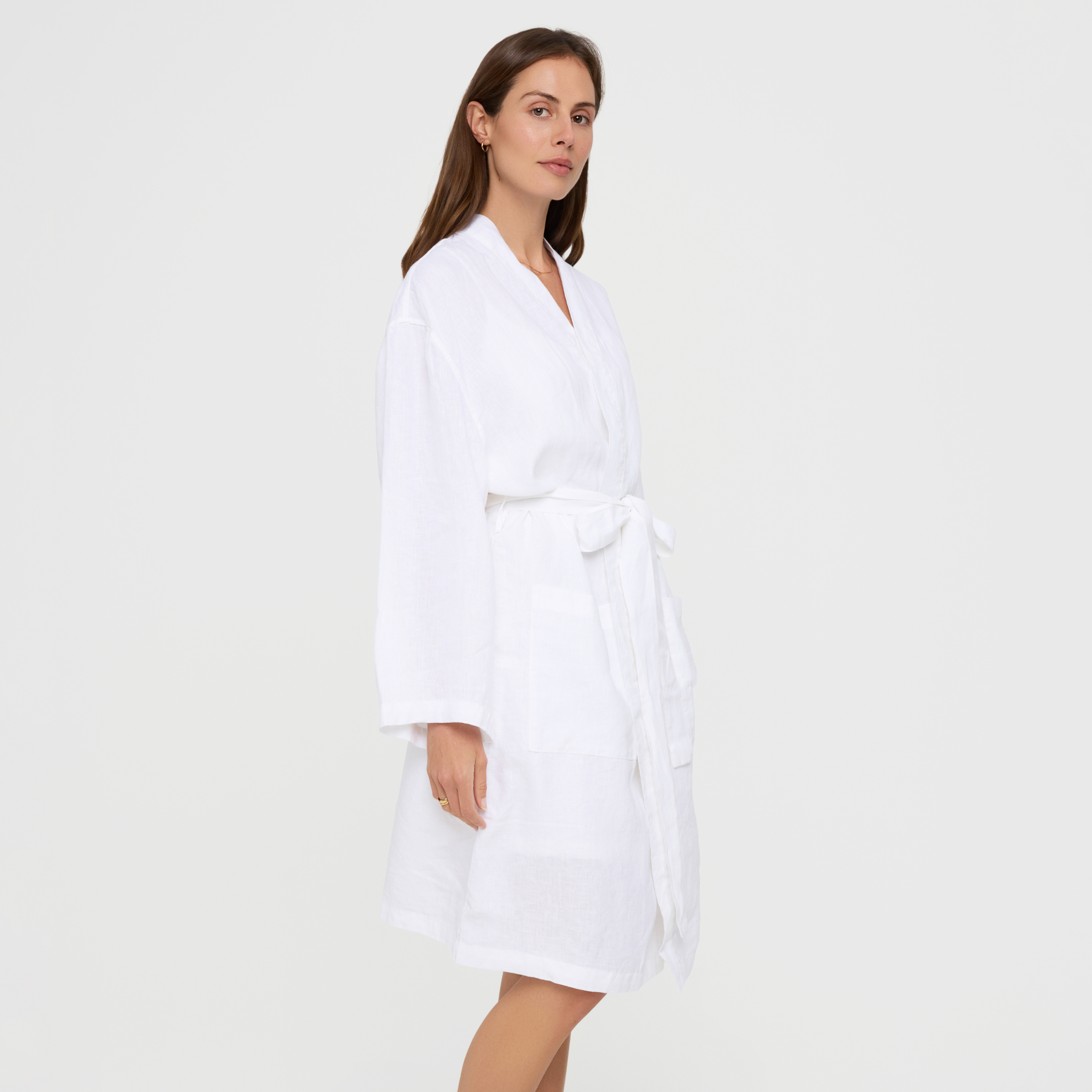 White linen bathrobe with pockets and wrap-style front